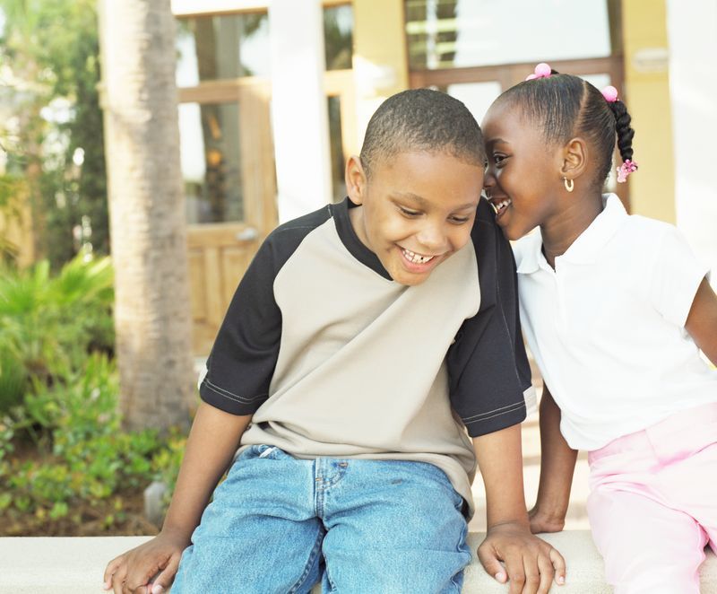 Two kids laughing and smiling