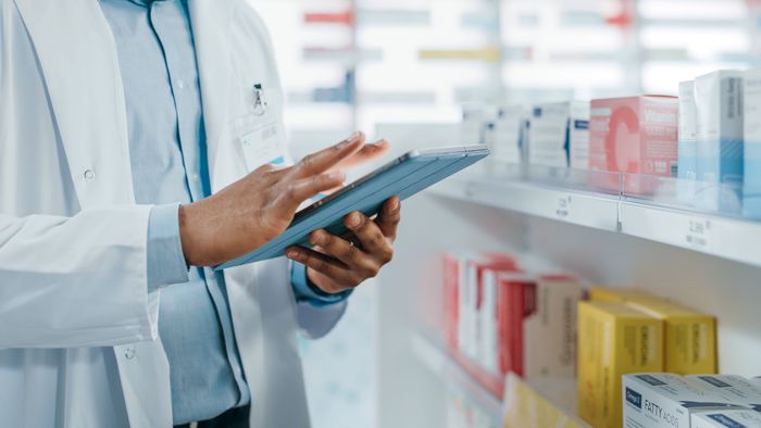 Pharmacist holding a tablet