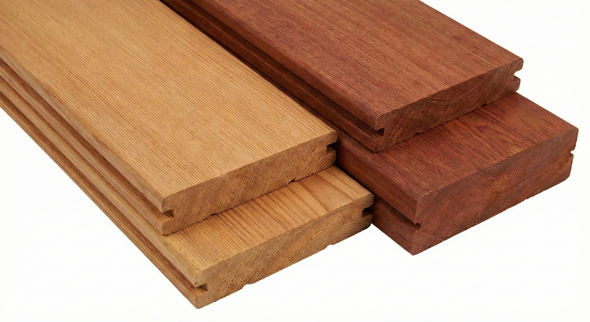 Two stacks of wooden planks, one light brown and one reddish-brown, with grooves along one edge.