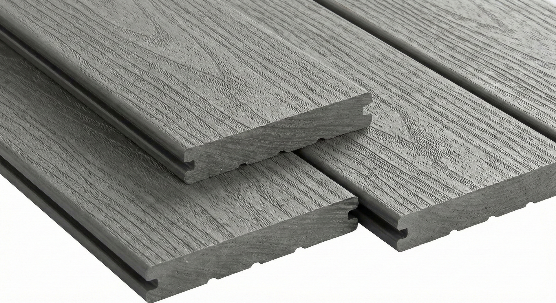 Gray composite decking boards, showing texture and grooves.