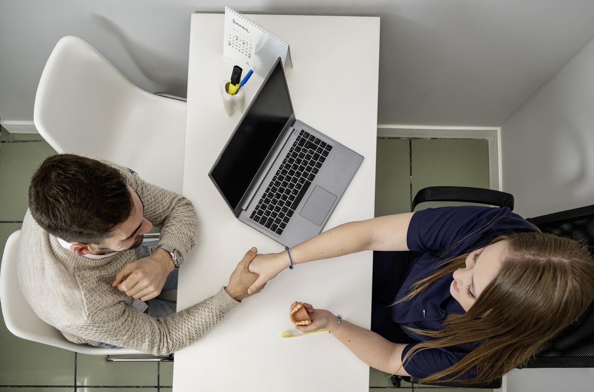 Patient talking to dentist during first visit in Southampton clinic