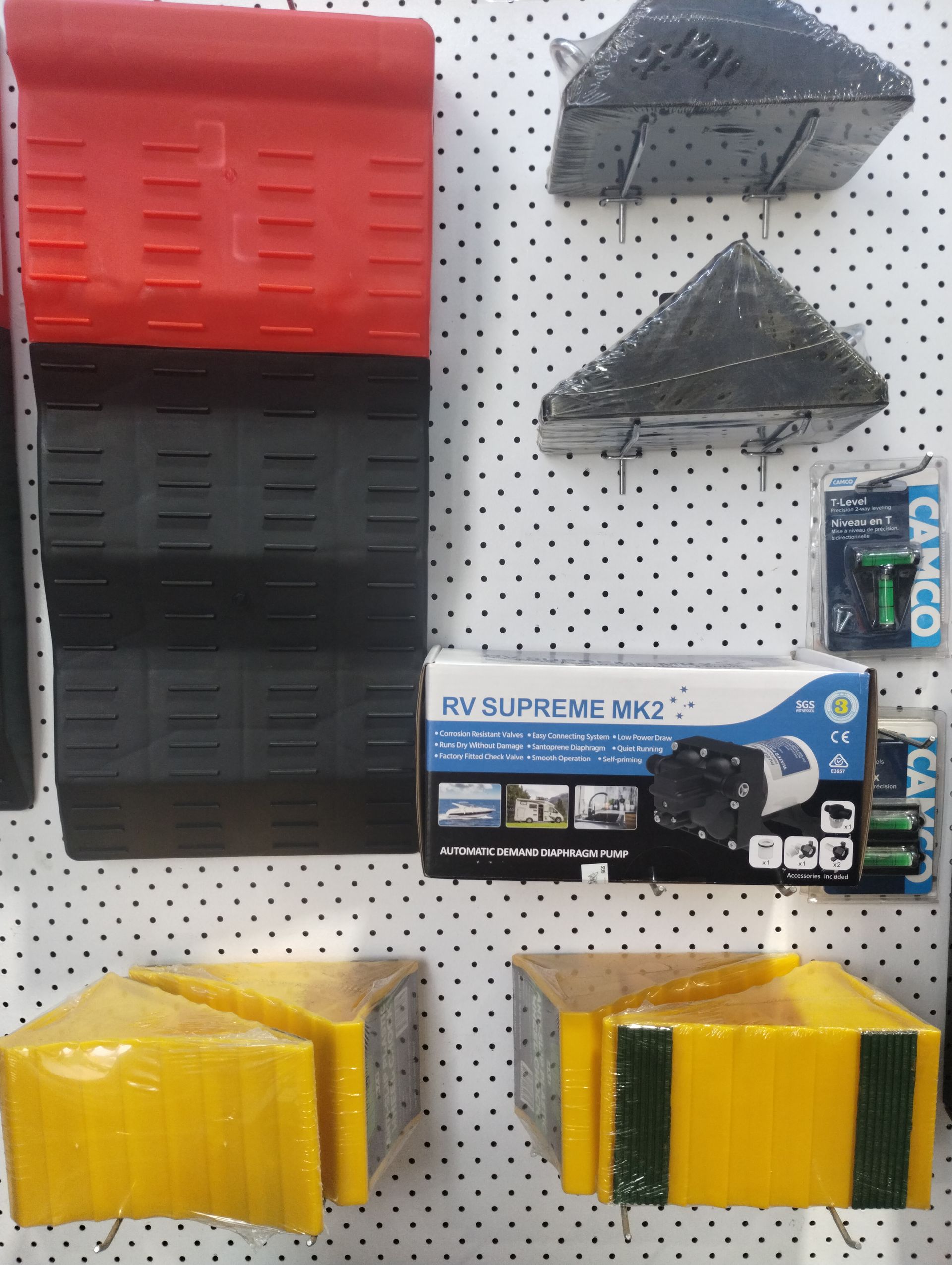 Caravan Accessories Displayed On A Wall With Hooks — Rainbow Beach Auto Electrics In Rainbow Beach, QLD