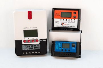 Three Solar Charge Controllers Are Sitting Next To Each Other — Rainbow Beach Auto Electrics In Rainbow Beach, QLD