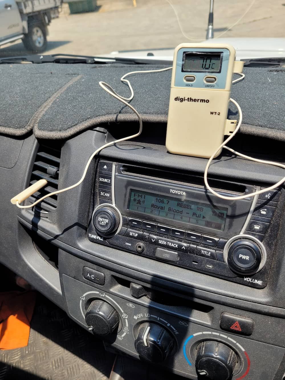 A Car Radio With A Thermometer Attached To It — Rainbow Beach Auto Electrics In Rainbow Beach, QLD