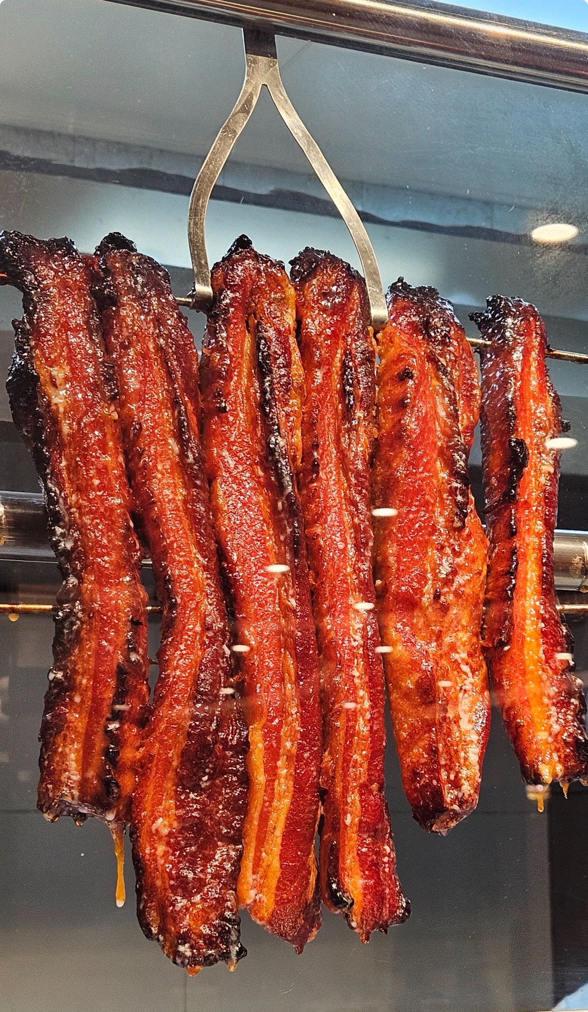 Meat strips are hanging from a hook — Red Lantern Chinese Restaurant In Palmerston City, NT