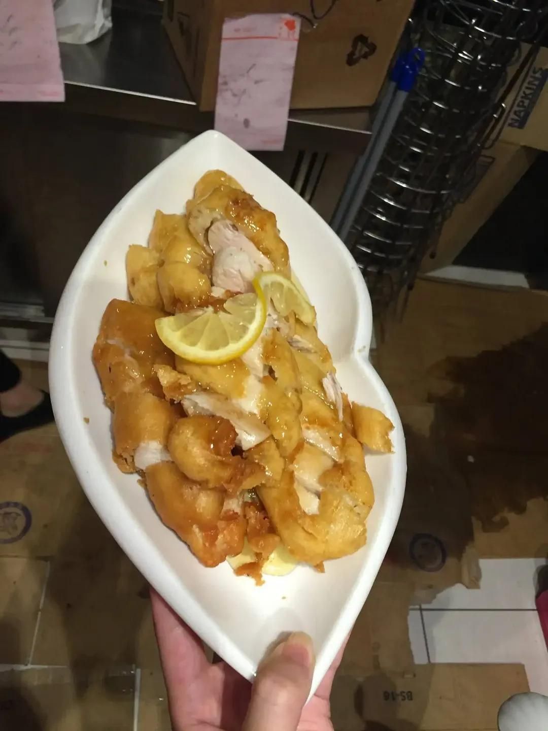 A Person is Holding a Heart Shaped Plate of Food — Red Lantern Chinese Restaurant In Palmerston City, NT