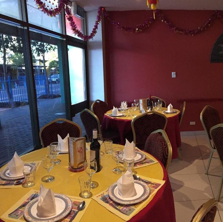 A Restaurant Filled With Tables and Chairs With Red Covers — Red Lantern Chinese Restaurant In Palmerston City, NT