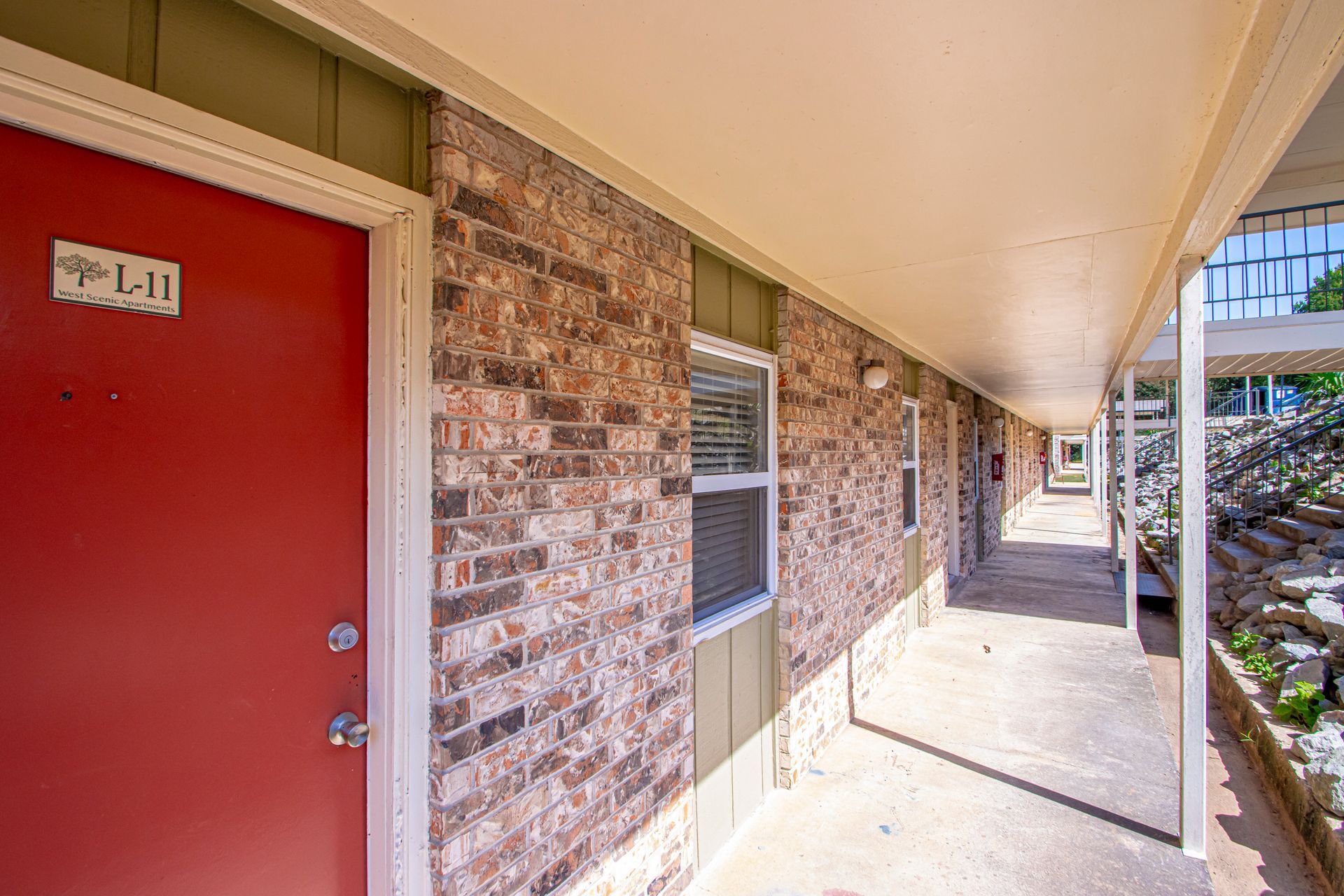 Red apartment door labeled 