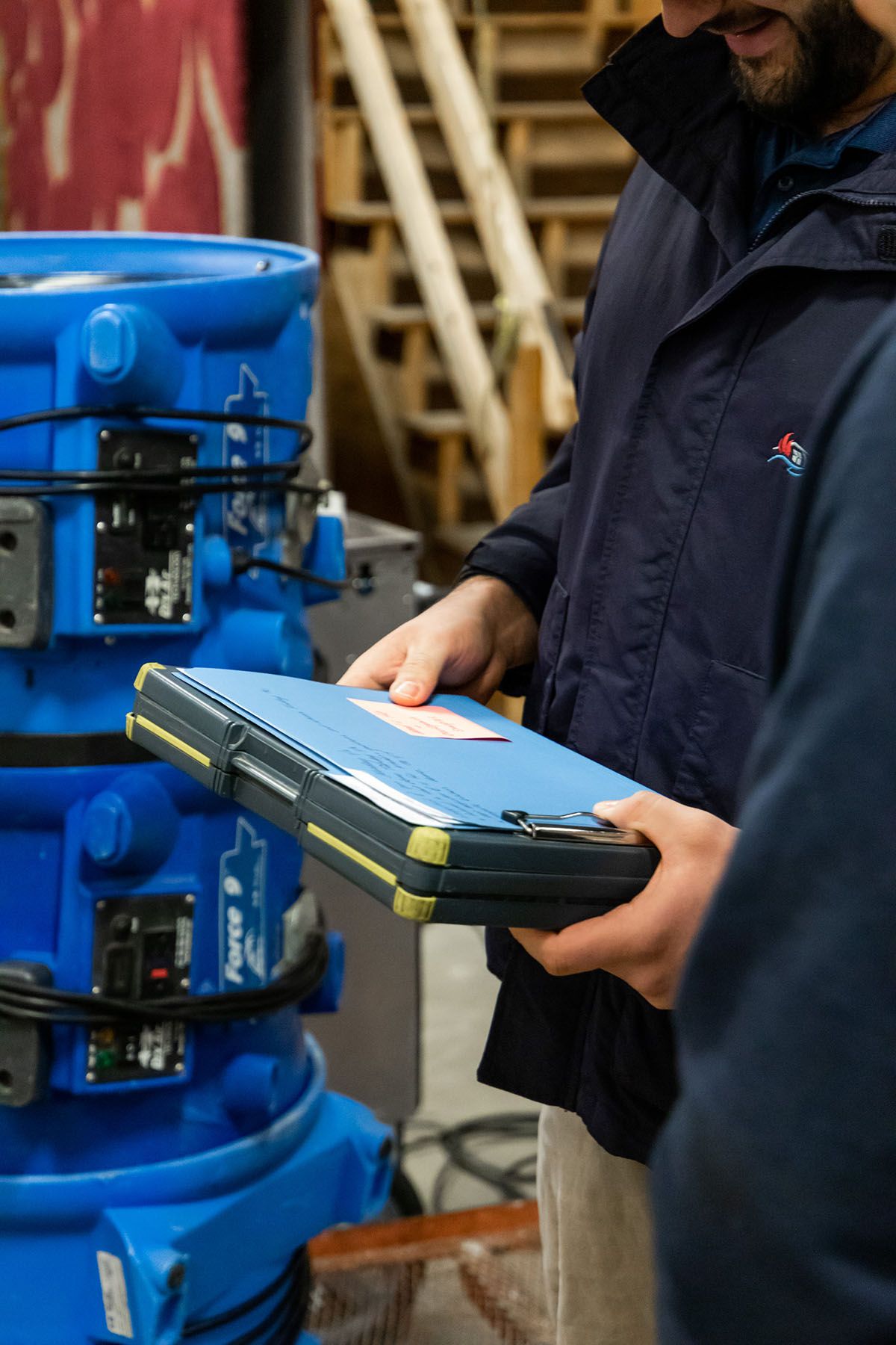 Craftech employees looking over papers