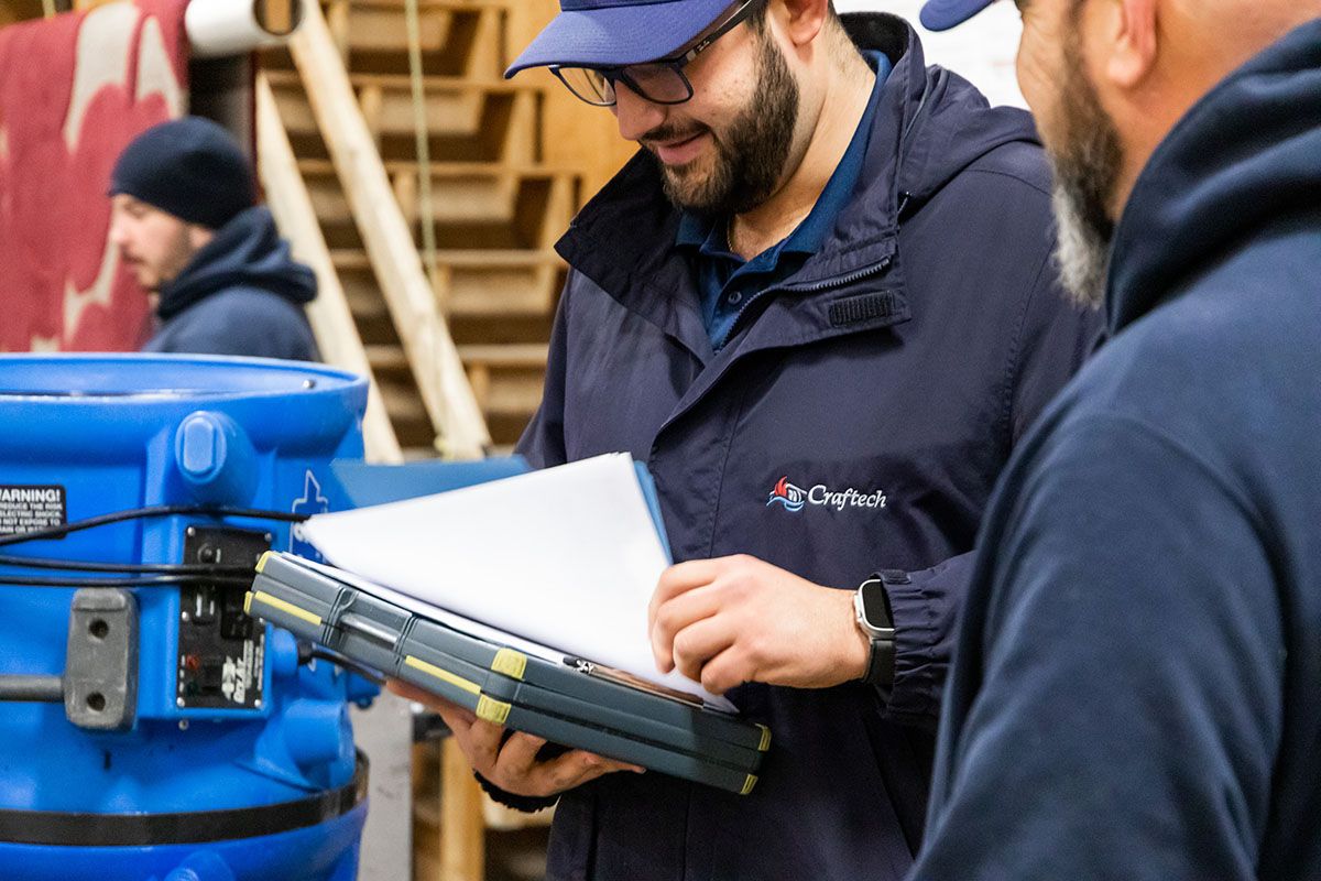 Craftech expert looking at papers