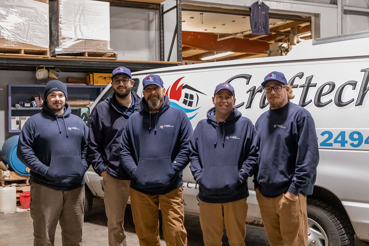 four Craftech employees together