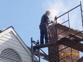 Men working on the chimney — Chimney Sweep in York, PA