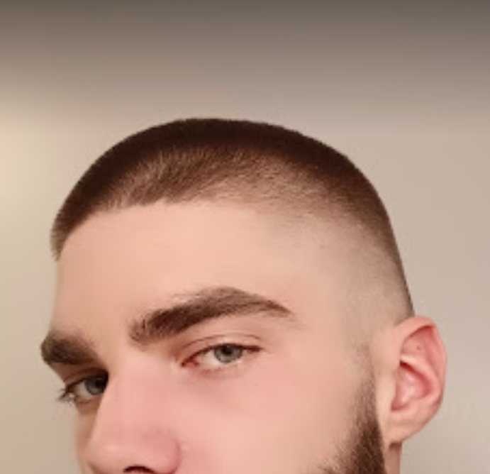 Two women with tattoos on their bodies are standing next to each other