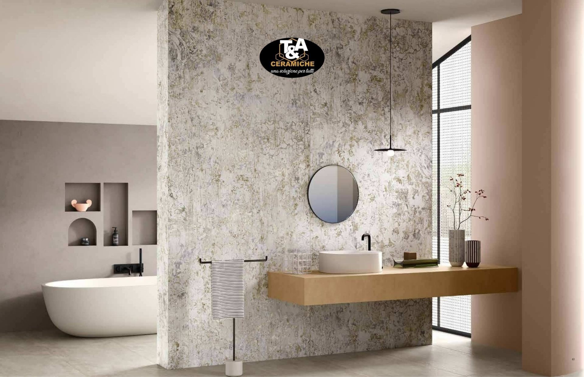 Bagno moderno con vasca bianca, lavabo sospeso e parete decorativa.