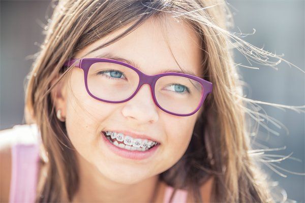 Happy Girl With Dental Braces — Munster, IN — Michael Perez DDS, PC