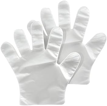Guantes de algodón blanco, un par superpuesto sobre un fondo blanco.