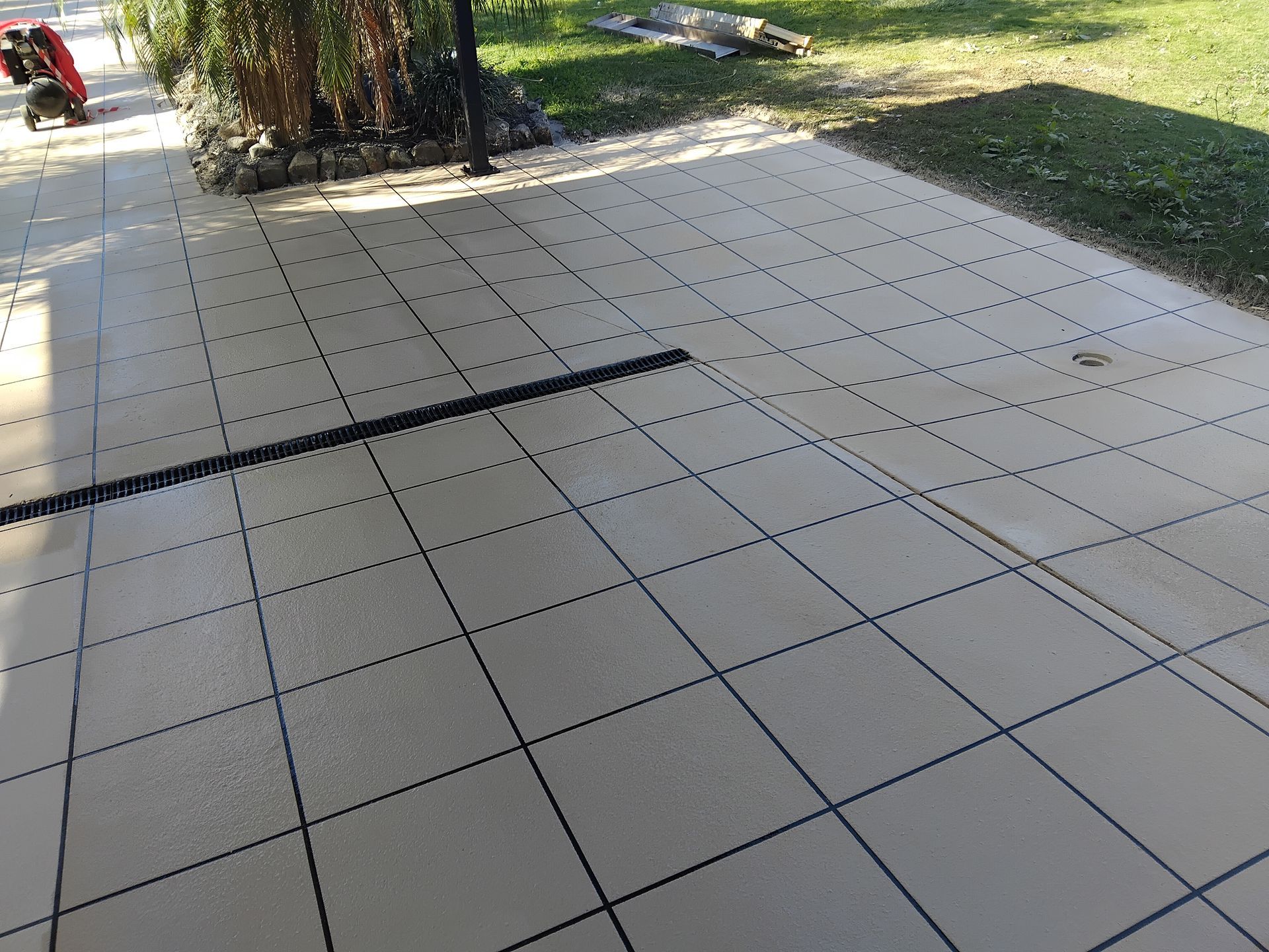 A Person is resurfacing concrete— Troys Concrete Overlays in Hillcrest, QLD