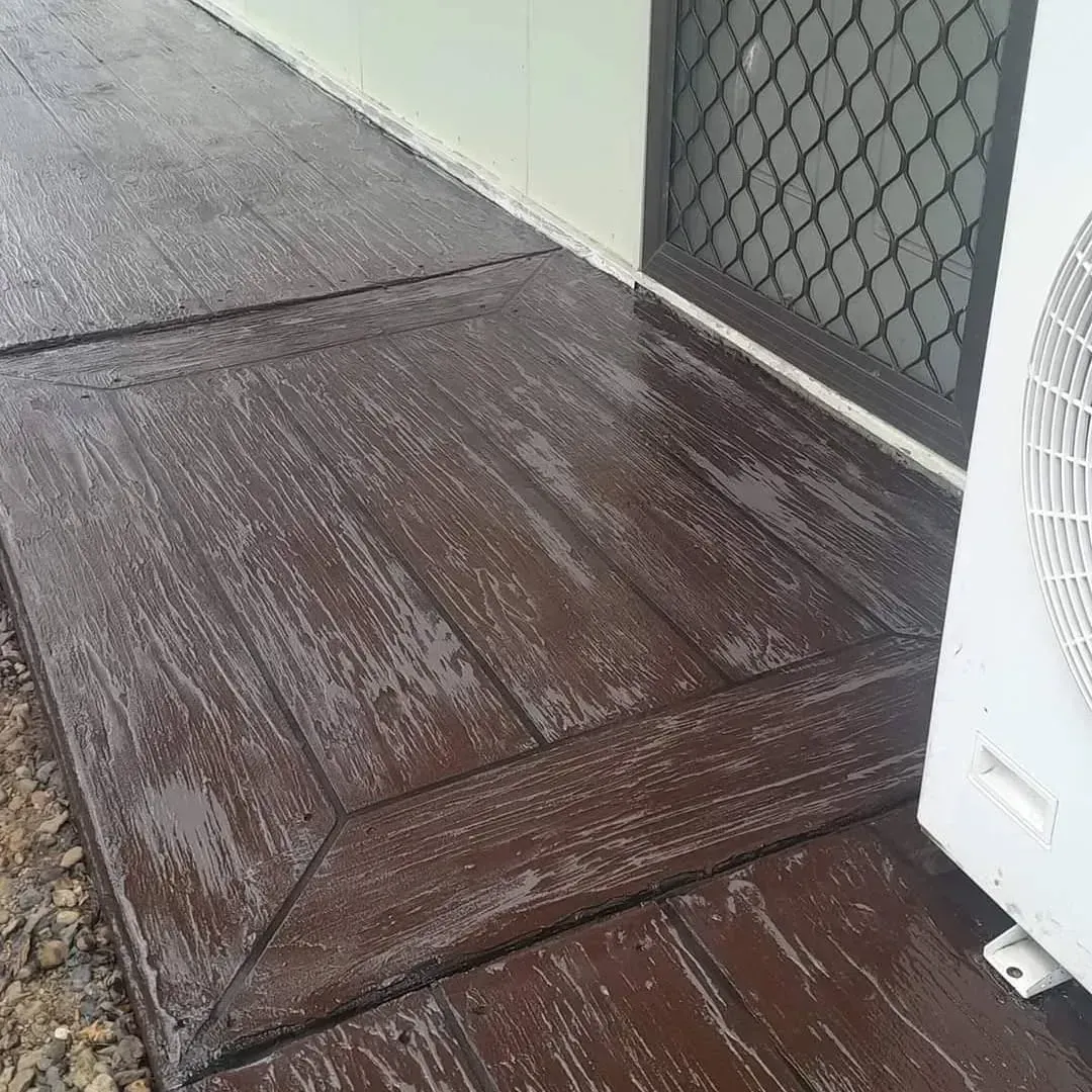 Dark brown wood plank concrete finish — Troys Concrete Overlays in Hillcrest, QLD