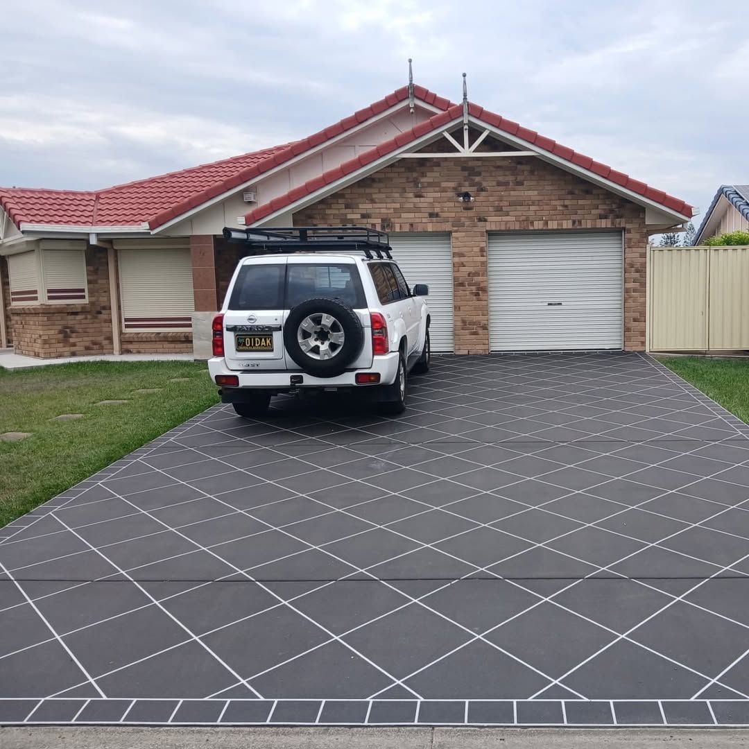 White Suv Parked in Front of a Brick House — Troys Concrete Overlays in Hillcrest, QLD