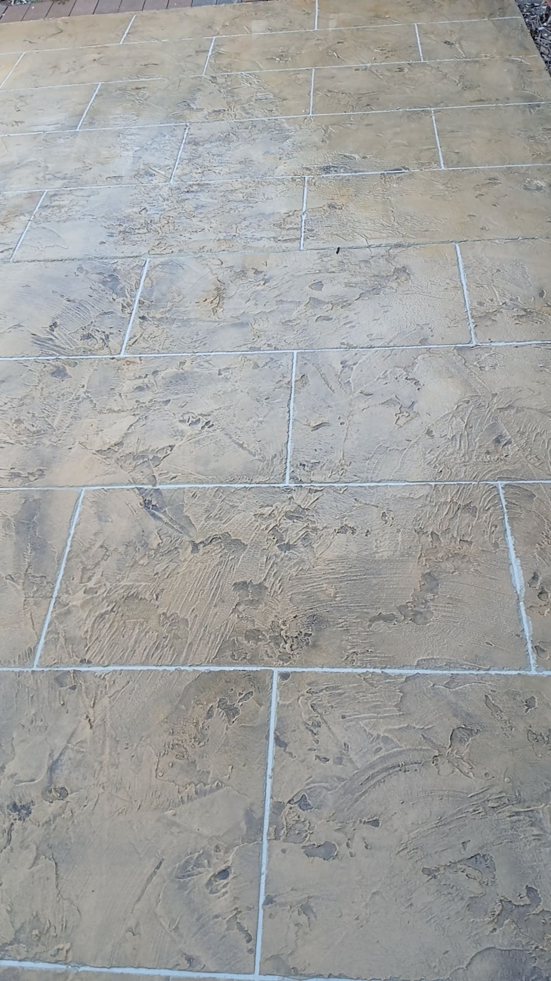 Light brown traverstine concrete finish — Troys Concrete Overlays in Hillcrest, QLD