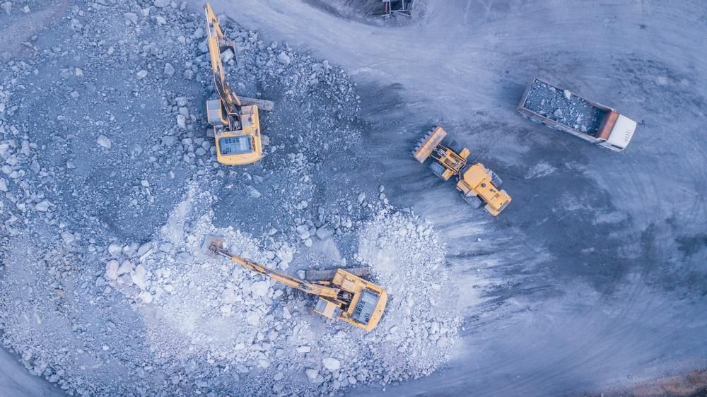 An Aerial View of a Site With Trucks and Tractors — S M & A J Gilbert Earthmoving in Mitchells Island, NSW