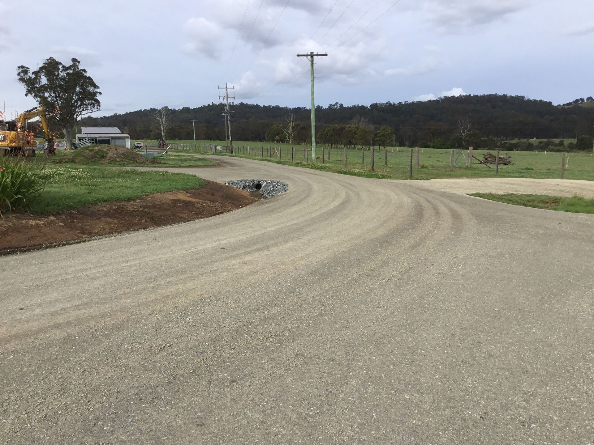 Two Bulldozers Are Working on a Construction Site in a Field — S M & A J Gilbert Earthmoving in Mitchells Island, NSW