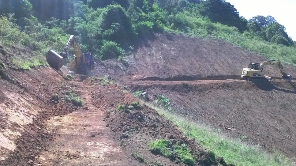 Two Excavators Clearing Land on a Hillside, Presumably for Road — S M & A J Gilbert Earthmoving in Mitchells Island, NSW