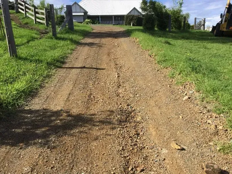 A Dirt Road Leading to a House in the Sunny Countryside — S M & A J Gilbert Earthmoving in Mitchells Island, NSW