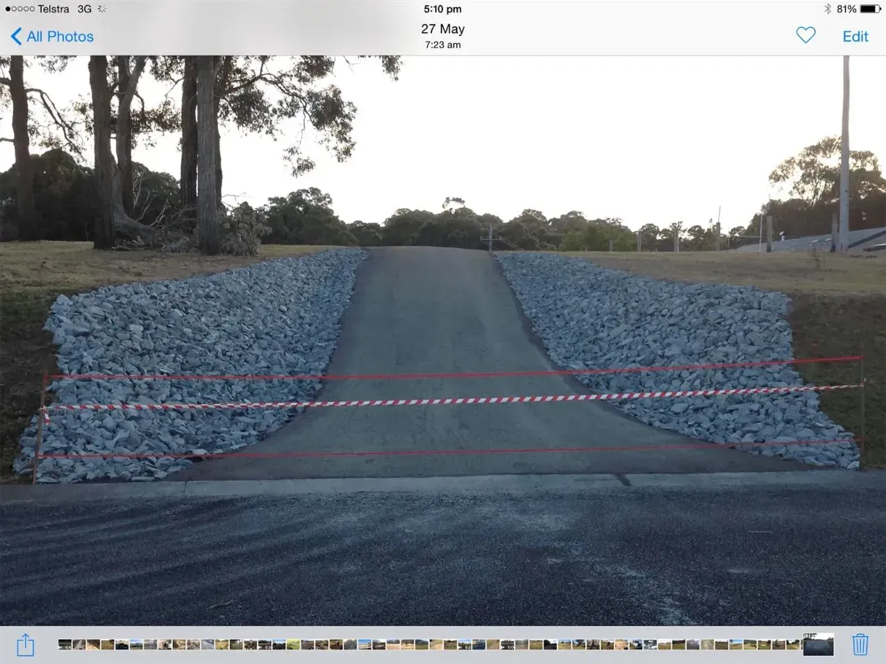 A Picture of a Road With Rocks on the Side of It — S M & A J Gilbert Earthmoving in Mitchells Island, NSW