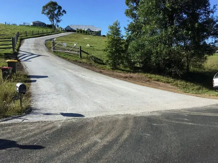 A Car is Parked on the Side of a Road Next to a Mailbox — S M & A J Gilbert Earthmoving in Mitchells Island, NSW