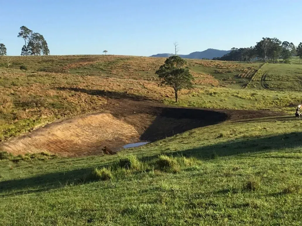 Brown and Green Landscape Under a Clear Sky — S M & A J Gilbert Earthmoving in Mitchells Island, NSW
