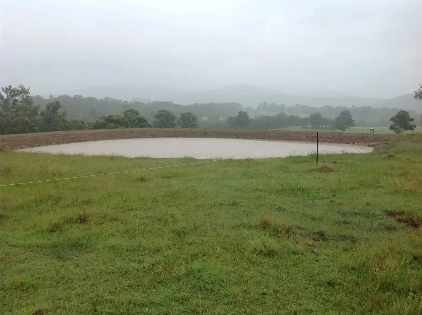 Rolling Hills and Trees Are in the Background — S M & A J Gilbert Earthmoving in Mitchells Island, NSW