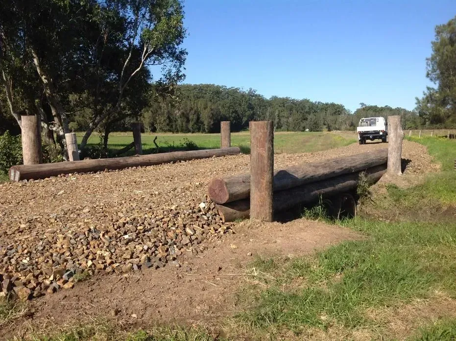 A White Truck is Parked on the Side of a Fence Of A Ranch — S M & A J Gilbert Earthmoving in Mitchells Island, NSW