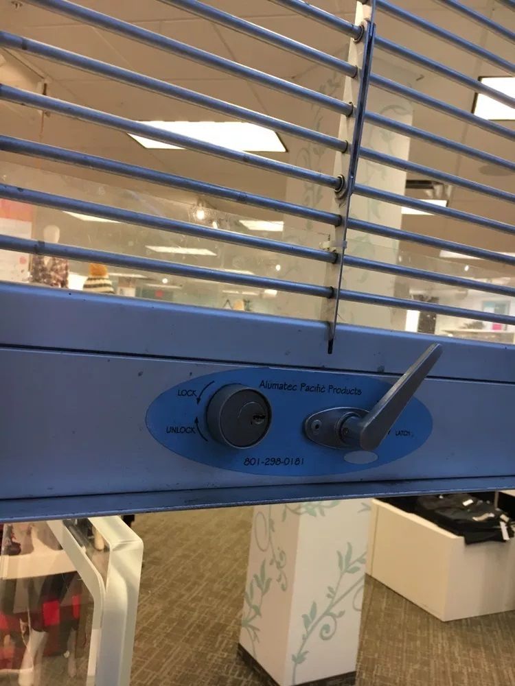 A close up of a blue fan in a store.