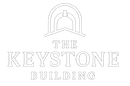 Logo for The Keystone Building, featuring an arched architectural element above the text.