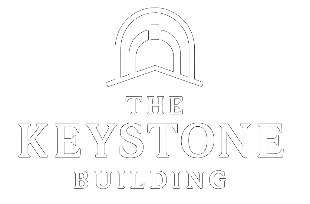 Logo for The Keystone Building, featuring an arched architectural element above the text.