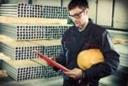 Worker in protective uniform and protective helmet - fabrication services - Mustang Fabrication, Inc. in Bellefonte PA