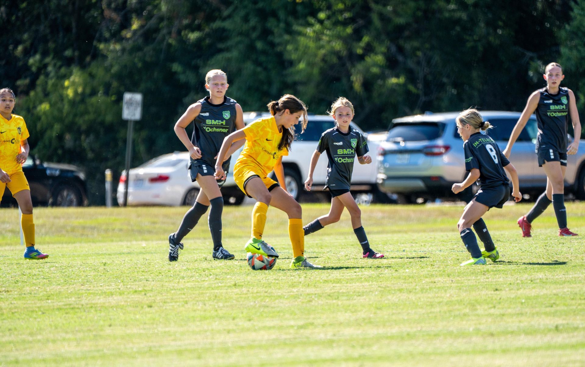 Olé FC youth player kicking the ball