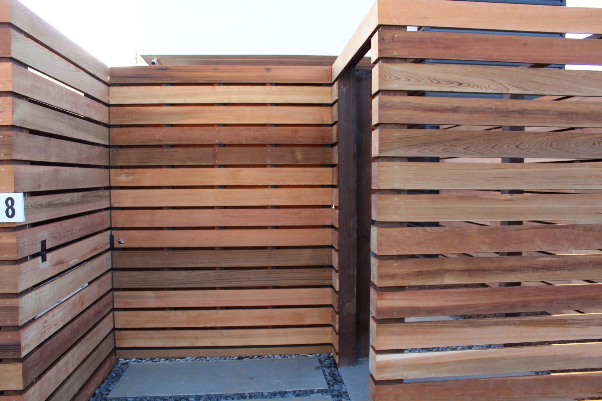 A wooden fence with the number 8 on it