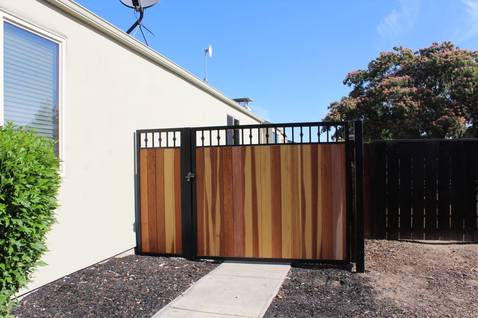 A house with a wooden gate in front of it