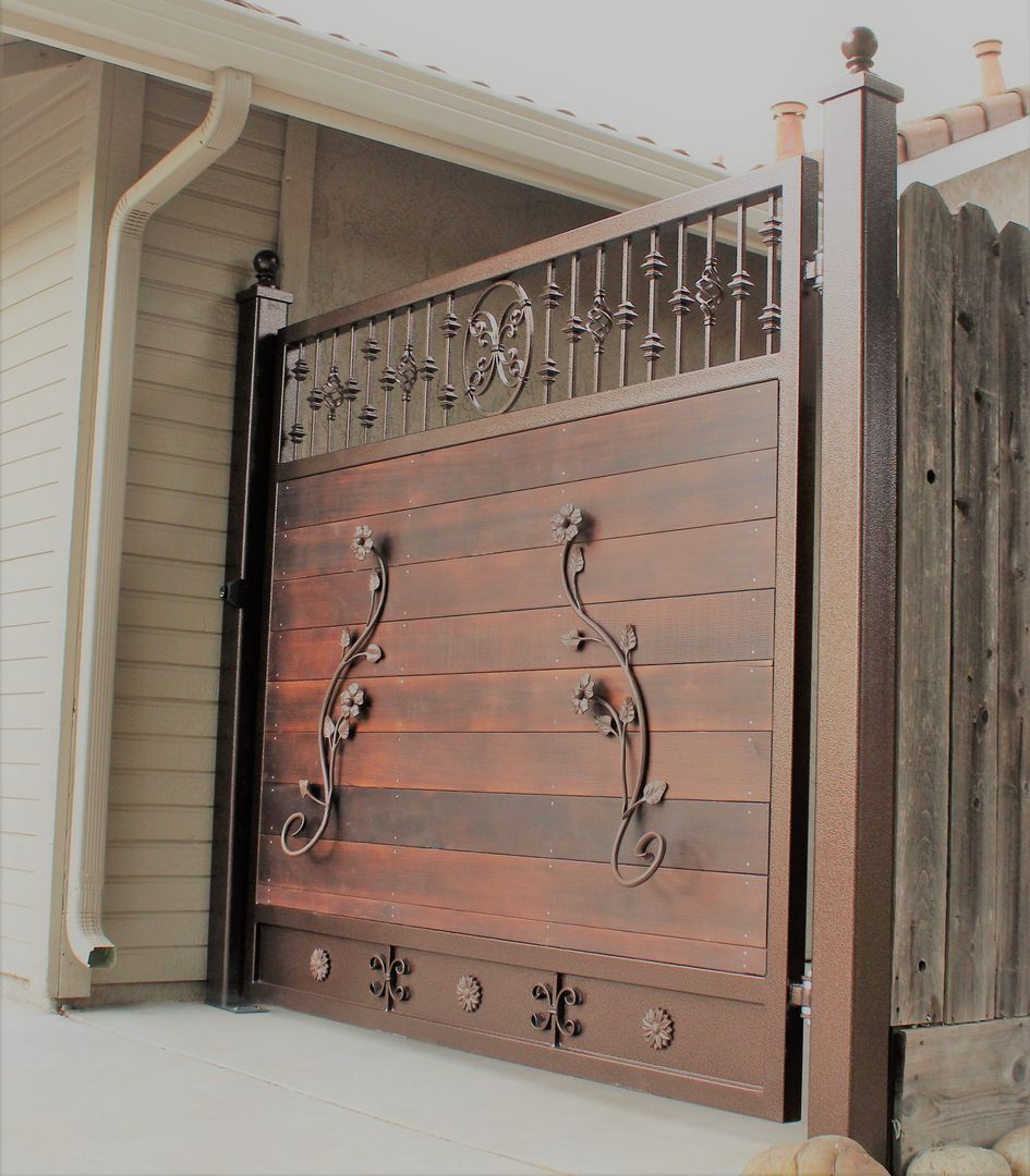 A wooden fence with a wrought iron railing