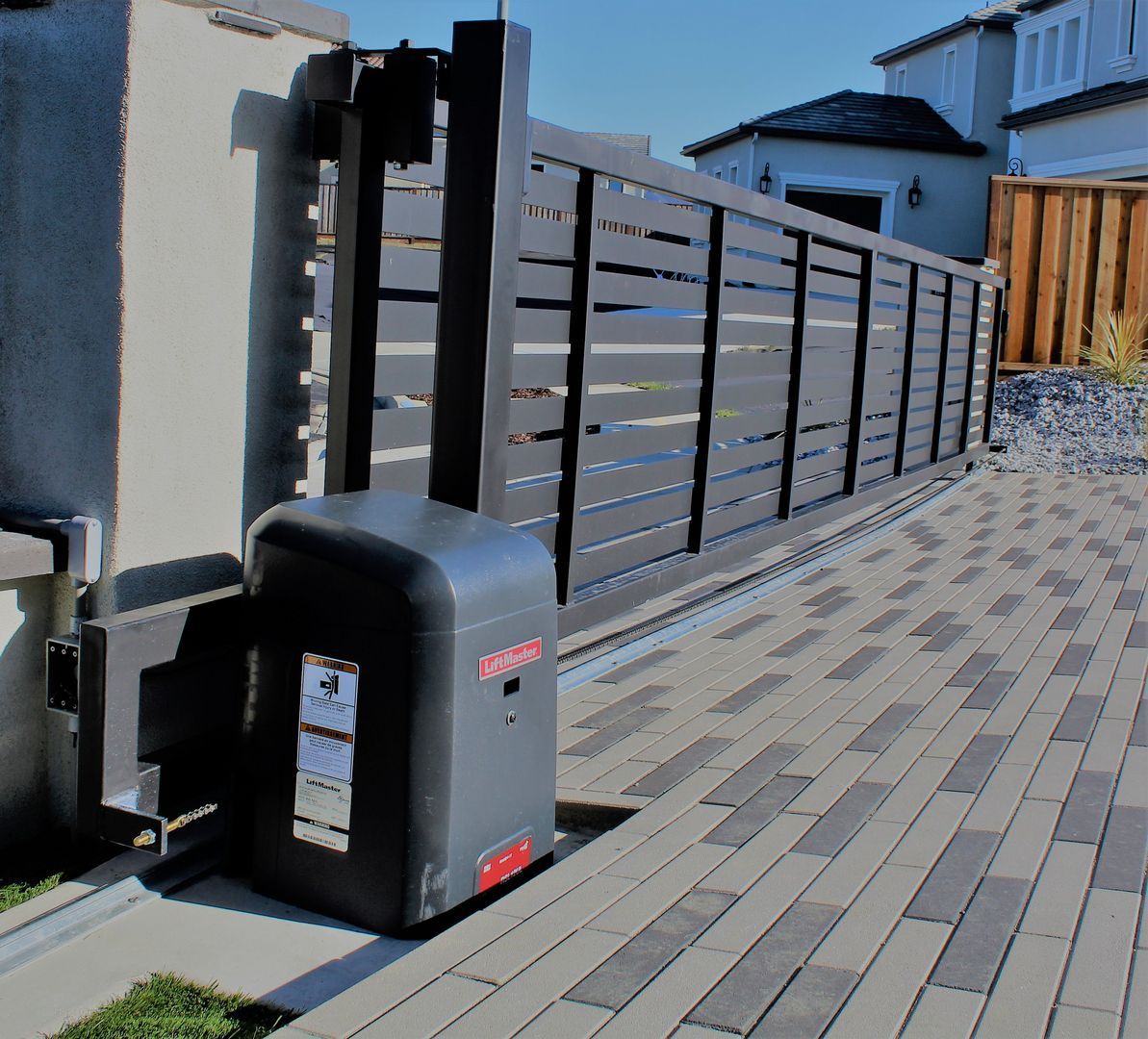 A sliding gate with a motor attached to it