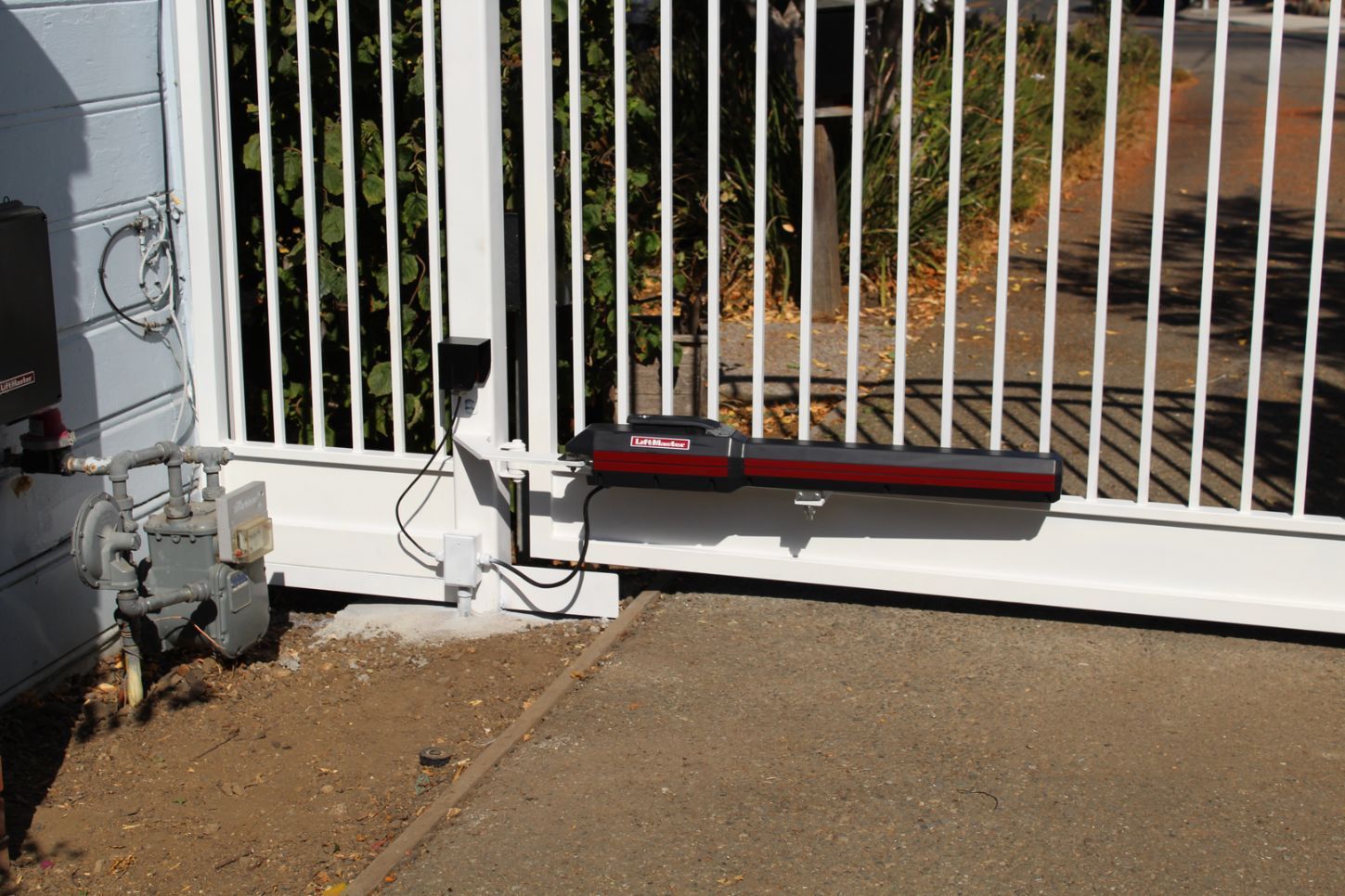 A sliding gate with a motor attached to it