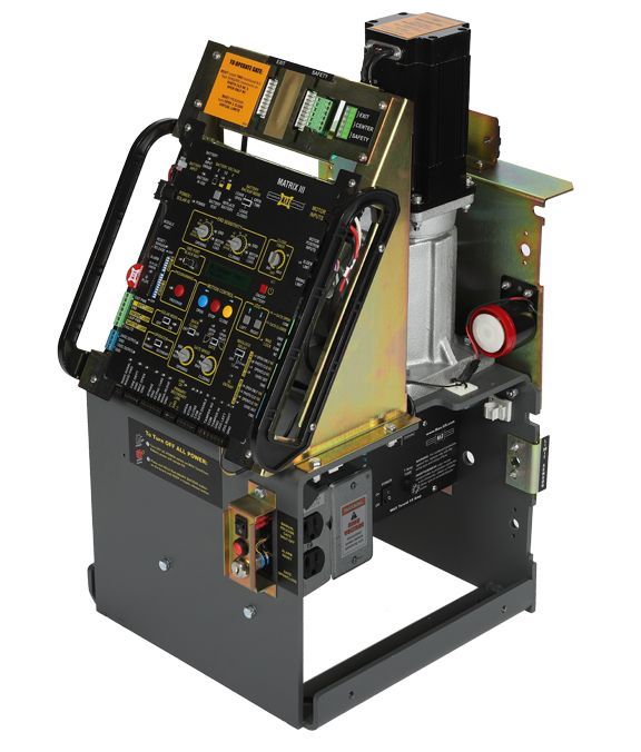 A machine with a lot of electronics on it is sitting on a table.