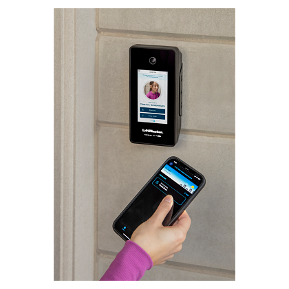 A person is using a smart phone to unlock a door