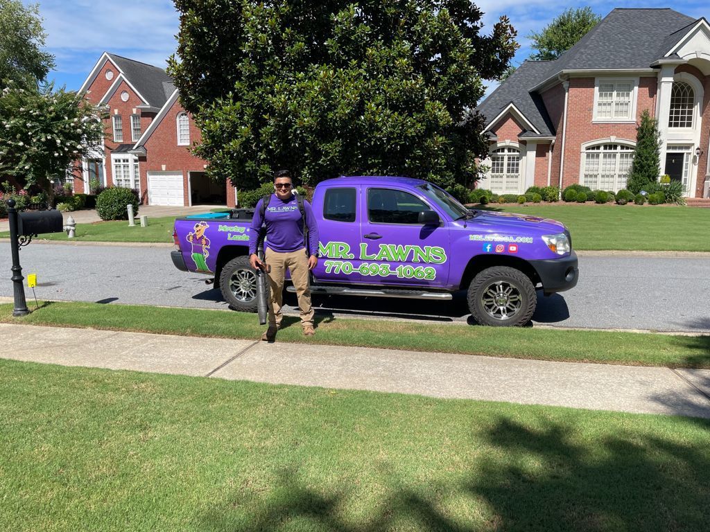 Man standing next to purple 