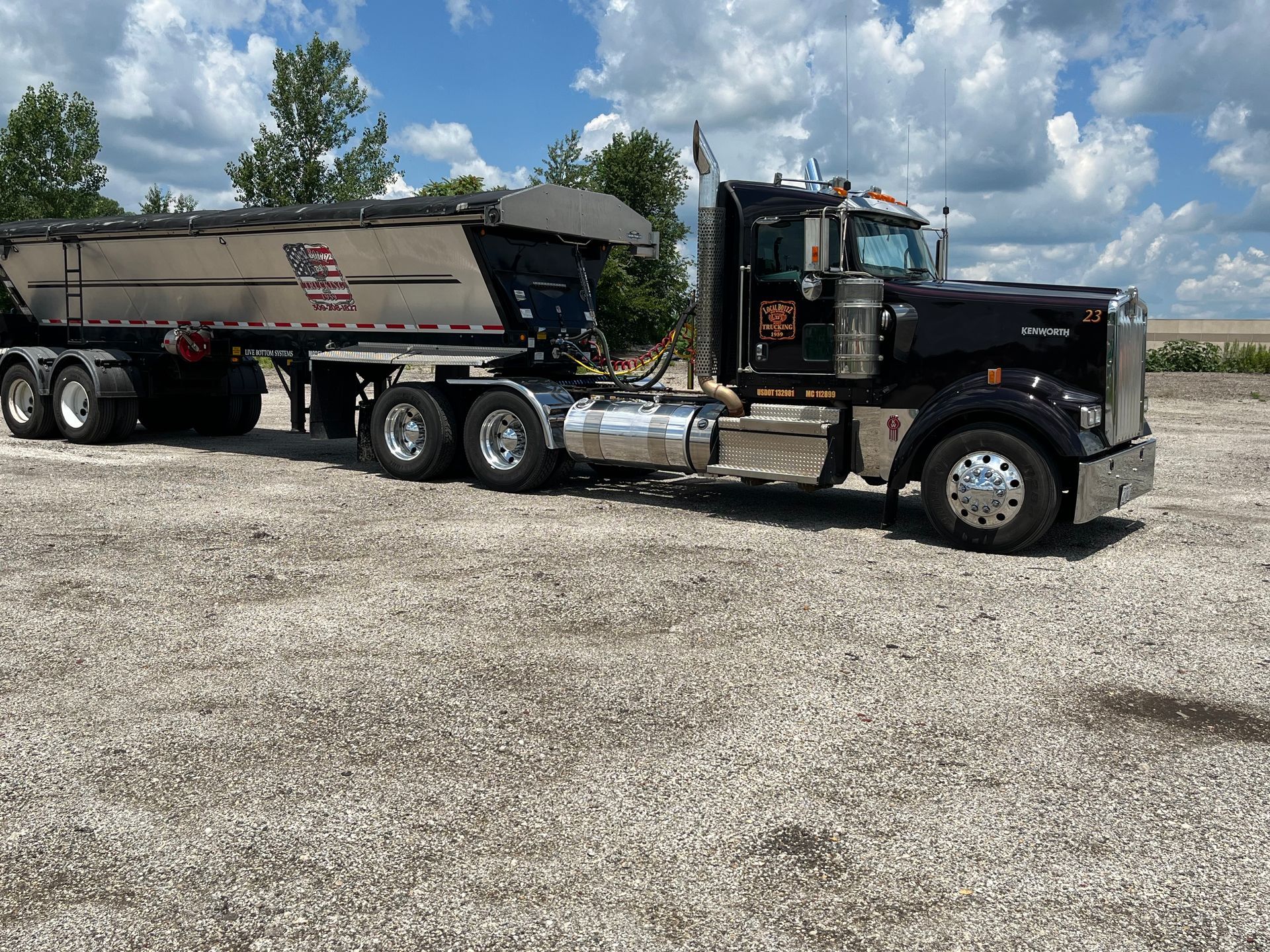 Excavator loading debris into a dump truck Excavator loading debris into a dump truck