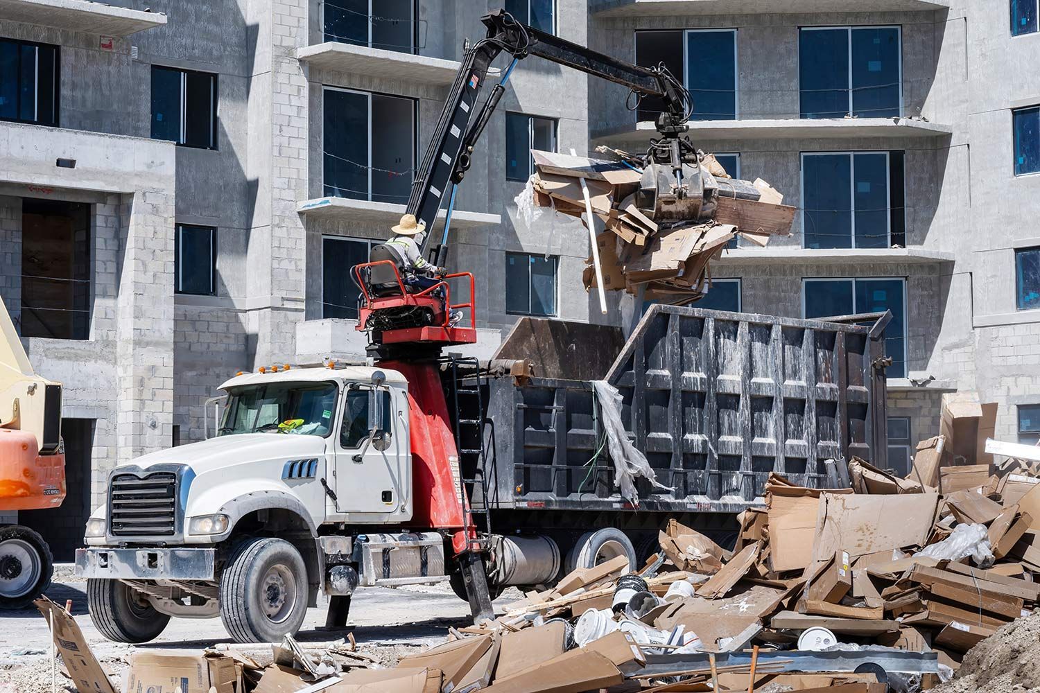 Excavator loading debris into a dump truck Excavator loading debris into a dump truck
