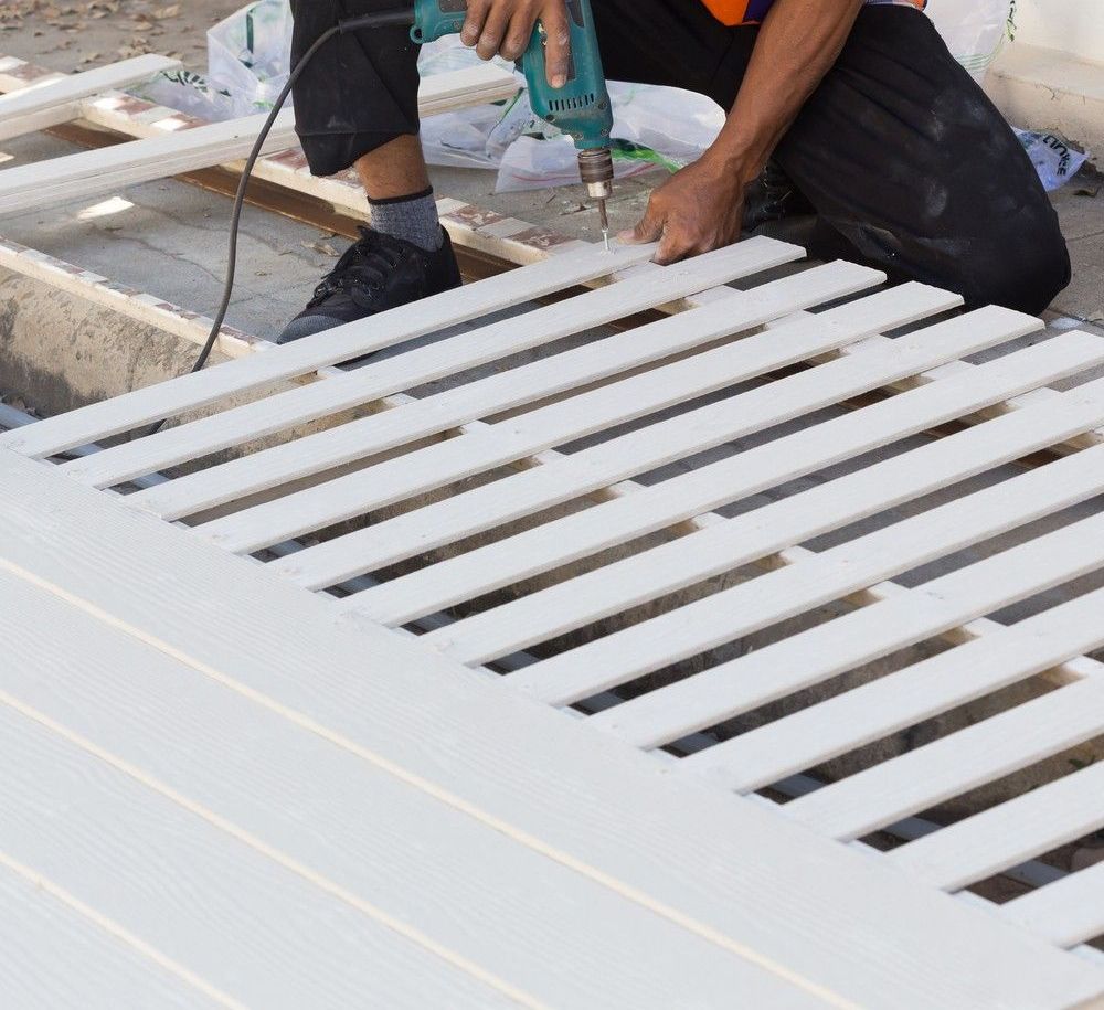 A Close Up Of Two Pieces Of Glass Sitting Next To Each Other — CQ Fencing & Retaining Walls In Clinton, QLD