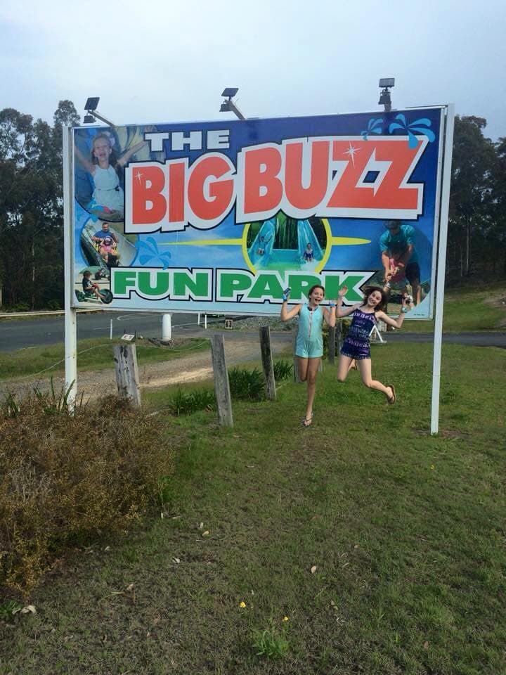 Two Girls At Fun Park Entrance In The Big Buzz Fun Park